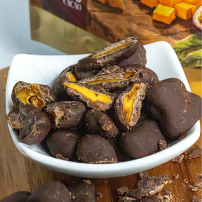 Drágeas de Manga e Maracujá com chocolate 52% cacau adoçado com açúcar de cana integral | 85g